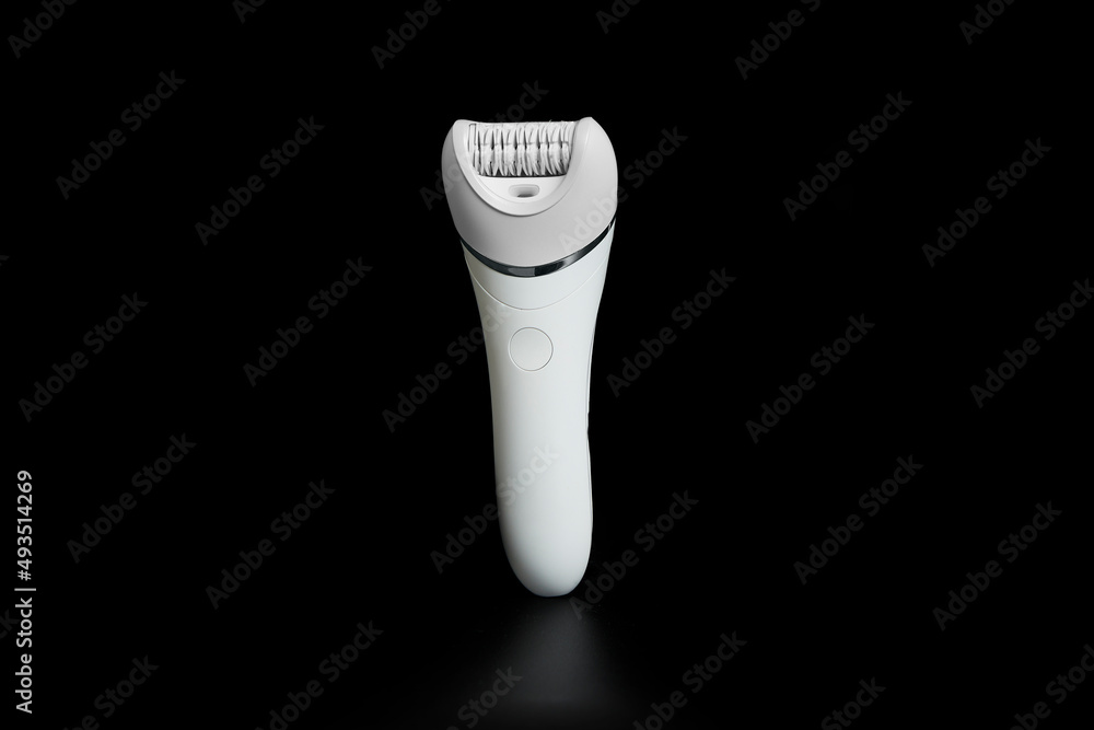 Hair removal machine with unmarked heads on black background. Hair removal machine with unmarked heads on black background.