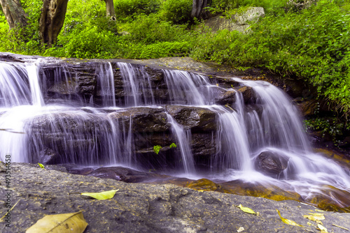 Fototapeta Naklejka Na Ścianę i Meble -  Waterfall in the forest . Autumn nature