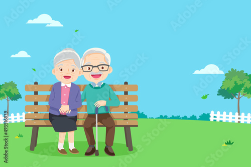 Grandparents are sitting on a bench in the park