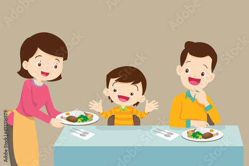 Mother serving food to her family