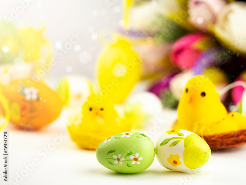 Bright Easter card with colorful eggs, funny chickens, flowers and other elements. Bright colorful festive background. © Наталья Майшева