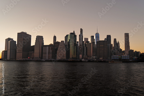 Scenic view of beautiful Manhattan skyline during sunset in New york city shot from across the Hudson river from Brooklyn bridge park in New York city