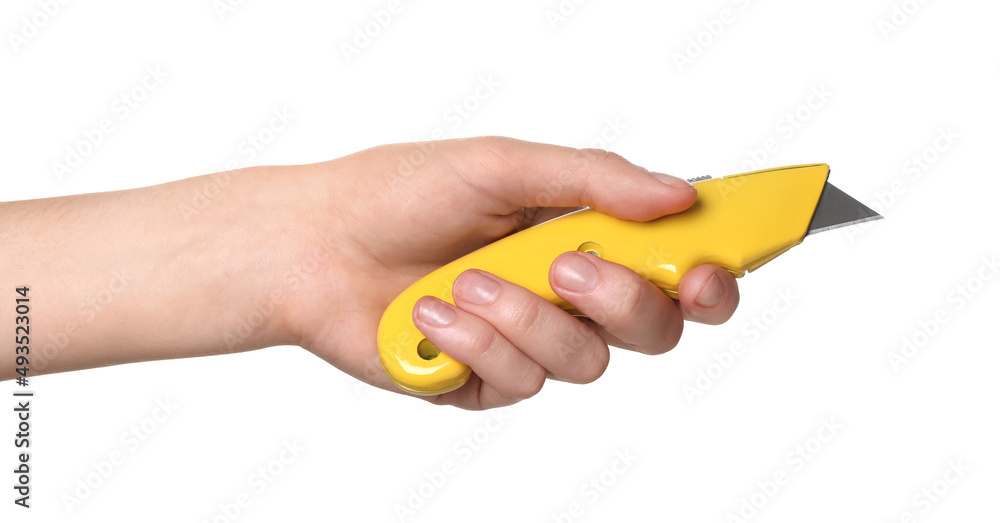 Woman holding utility knife on white background, closeup Woman holding utility knife on white background, closeup