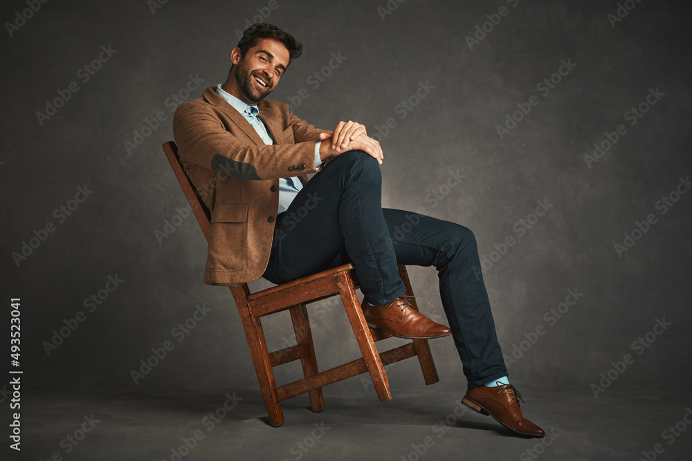 Perfect shoes and outfit, his ready to rule the day. Studio shot of a handsome young man posing against a gray background. - obrazy, fototapety, plakaty 