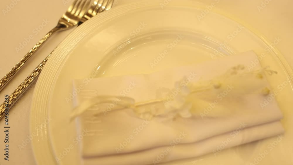 napkin on a table in a restaurant on a plate napkin on a table in a restaurant on a plate