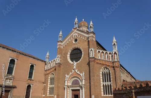 Beautiful red brick Italian church against the blue sky. Detail of the Madonna dell'Orto church, Venice, Italy.