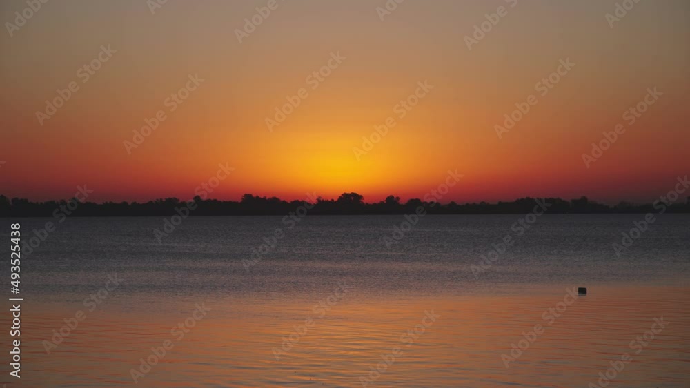 Orange blue sunset lake, beautiful and inspiring sunset horizon on the lake Orange blue sunset lake, beautiful and inspiring sunset horizon on the lake