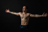 Man on black background keeps dumbbells pumped up in fitness chest torso, athlete training exercise lifting heavy, male Young power, human fit