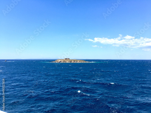 A lonely island in the middle of the sea., good view under the pure sky