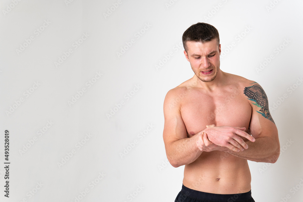 Muscles on the arm ache in a man on a white background back sore injury, male background human chronic. Touching lumbar sickness, disease suffer attractive
