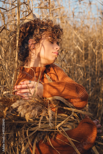 Profile of beautiful young woman outdoor posing, beautiful side view of her face