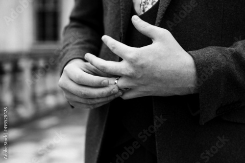 close up of a man holding his hands