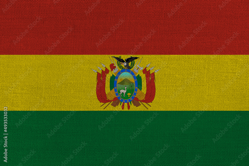 Fototapeta premium Patriotic textile background in colors of national flag. Bolivia