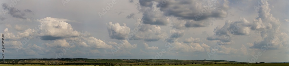 Tragic gloomy sky. The village in the Budjak steppe. Panoramic landscape.