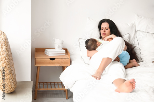 Young woman breastfeeding h...