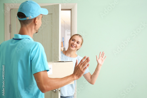 Young woman receiving parce...