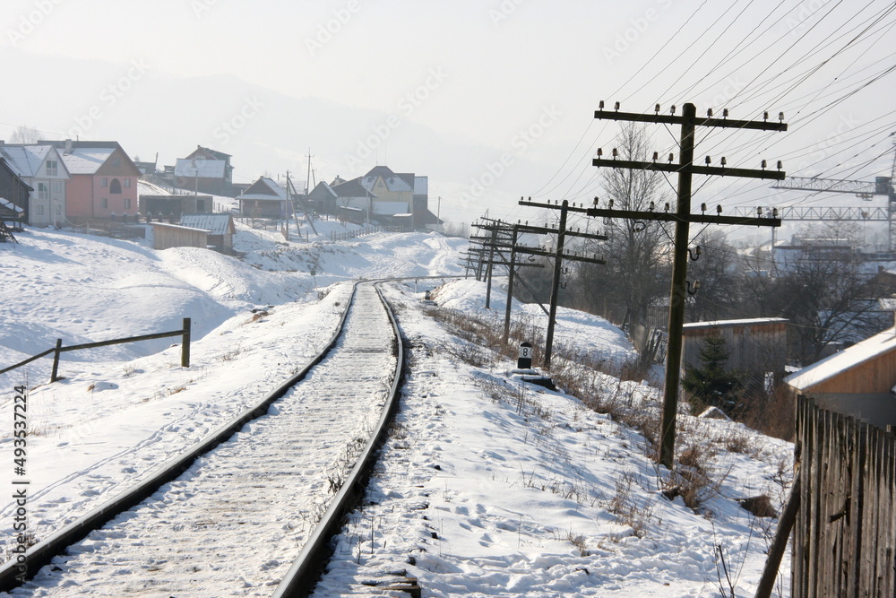Railway line in Ukraine in the Carpatians in winter, snowy weather Railway line in Ukraine in the Carpatians in winter, snowy weather