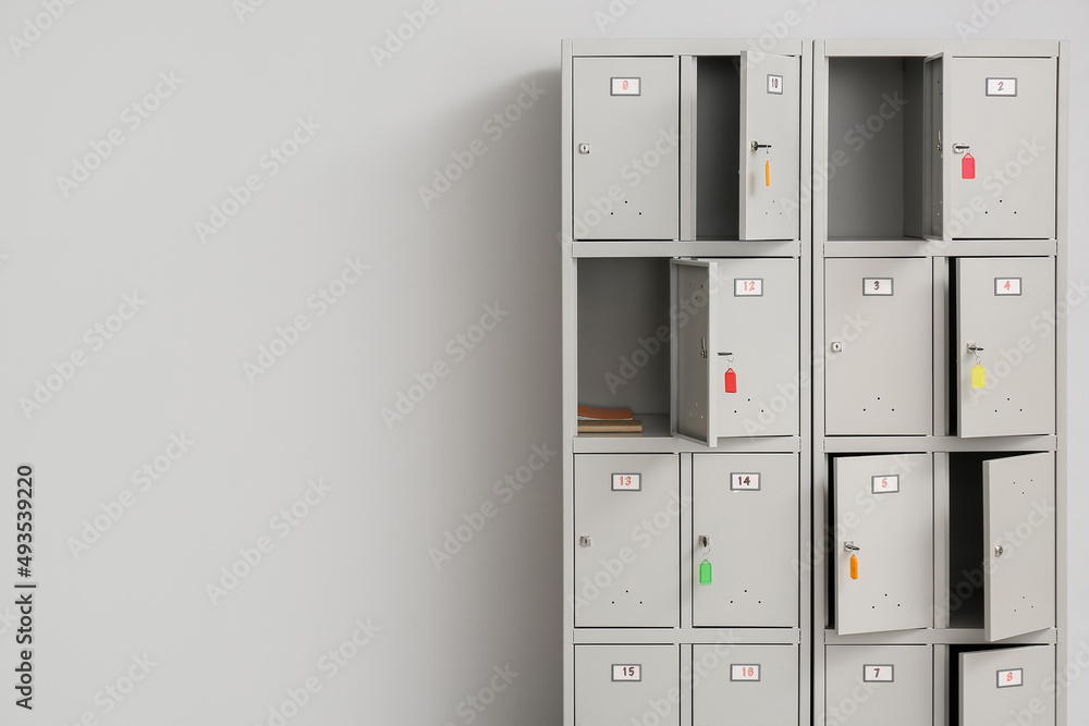 Modern locker near light wall