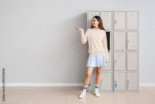 Female student near locker ...