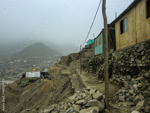 Houses of different construction materials in a low-income human settlement in Peru.