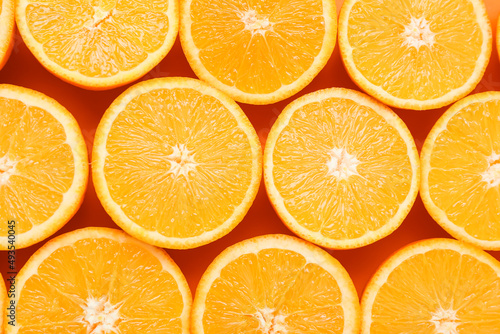 Slices of juicy orange as background  closeup