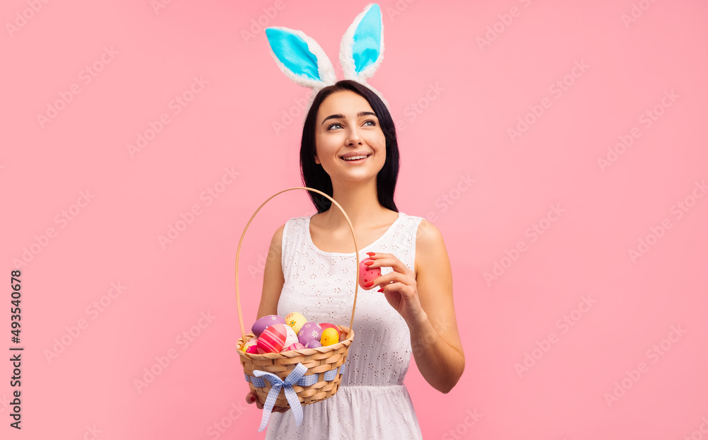 beautiful woman in rabbit ears with a basket of Easter eggs, on the Easter holiday beautiful woman in rabbit ears with a basket of Easter eggs, on the Easter holiday