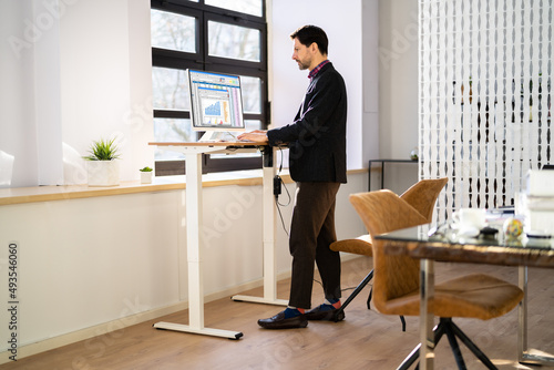 Adjustable Height Desk Stand In Office photo