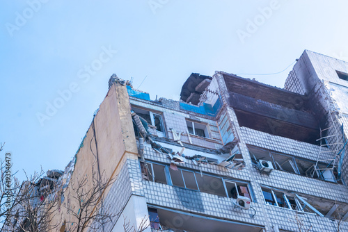 Damaged multi-storey building in Kyiv, the consequences of Russian missile attacks in the capital of Ukraine. War and aggression of Russia against Ukraine. photo