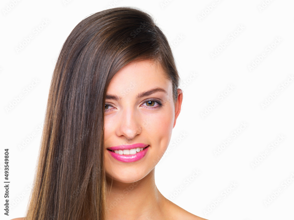 Her charm is part of her appeal. Studio portrait of a beautiful young woman posing against a white background. Her charm is part of her appeal. Studio portrait of a beautiful young woman posing against a white background.