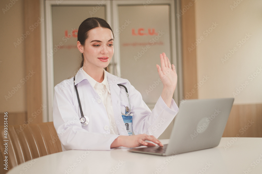 Woman caucasian doctor using computer for online health consult Woman caucasian doctor using computer for online health consult