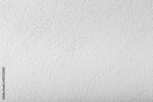 Abstract close up texture photo of compressed white styrofoam background..