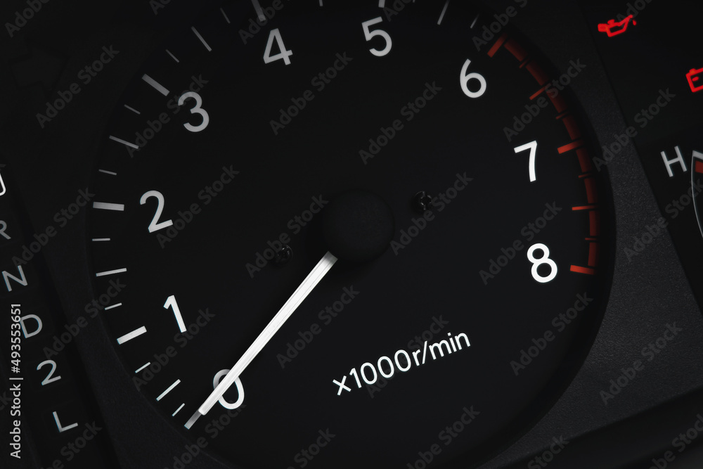 Close up shot of car dashboard. Speedometer on dial gauge. Automobile detail.