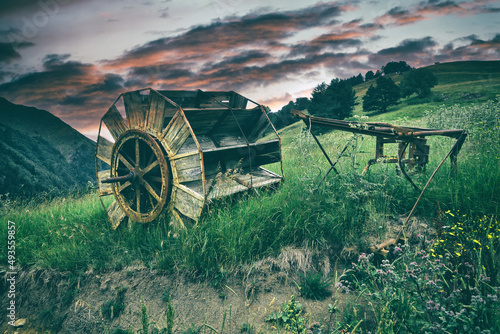 Mountain haymaking meadows and old haymaking peasant tools (a hay grinder). North Caucasus, Karachay-Cherkessia photo