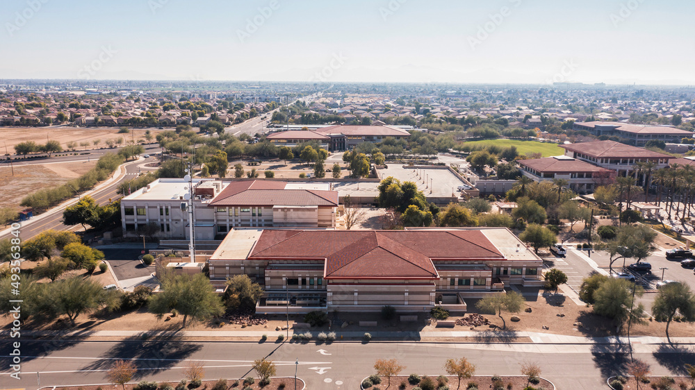 Afternoon aerial view of the downtown skyline and surrounding housing of Peoria, Arizona, USA.