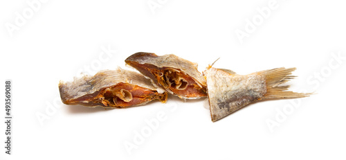Dried fish cut into slices on a white background