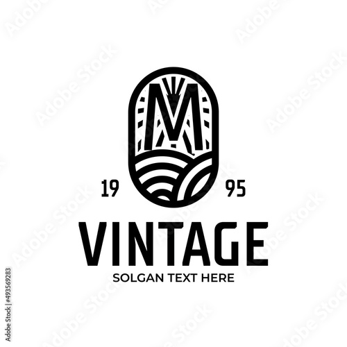 Vintage frame letter M logo design. Antique label Suitable for tattoo studio, brewing, whiskey, farm