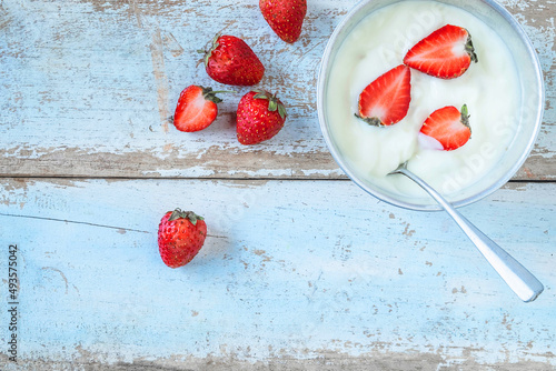 .Natural yoghurt and strawberry fruit On the wood background