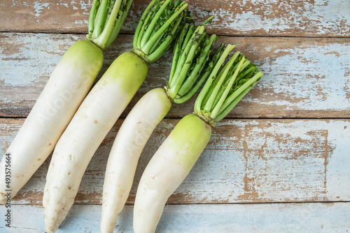 .Radish on a wooden background