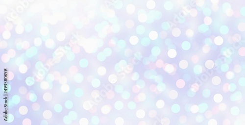 Light blue bokeh holiday decorative banner. Pastel brilliance textured background. Xmas template.