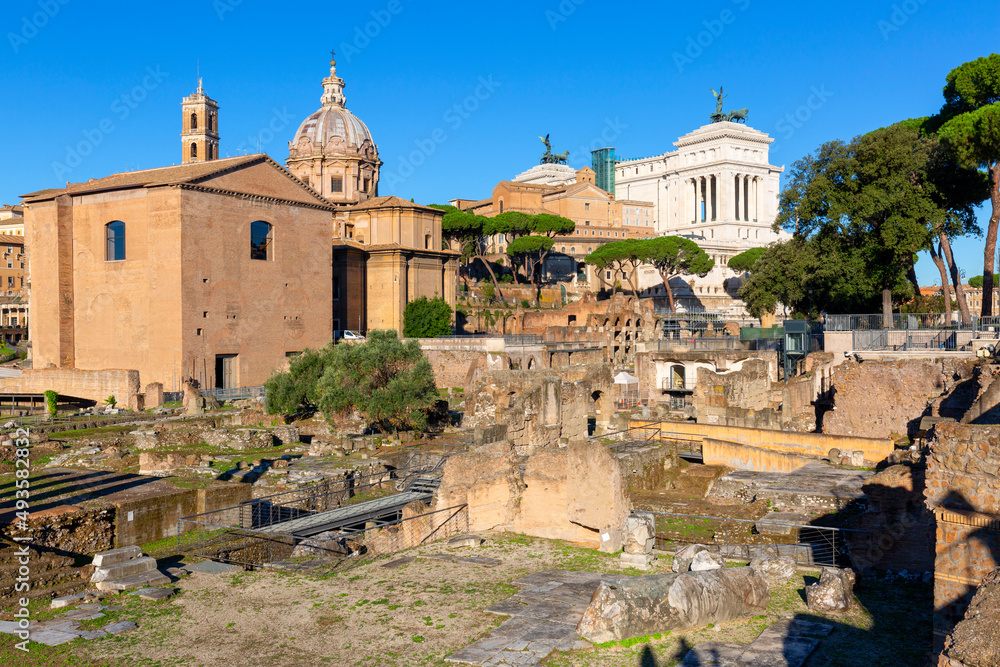 Forum Romanum, view of ruins and  dome of Santi Luca e Martina church and Victor Emmanuel II Monument, Rome, Italy