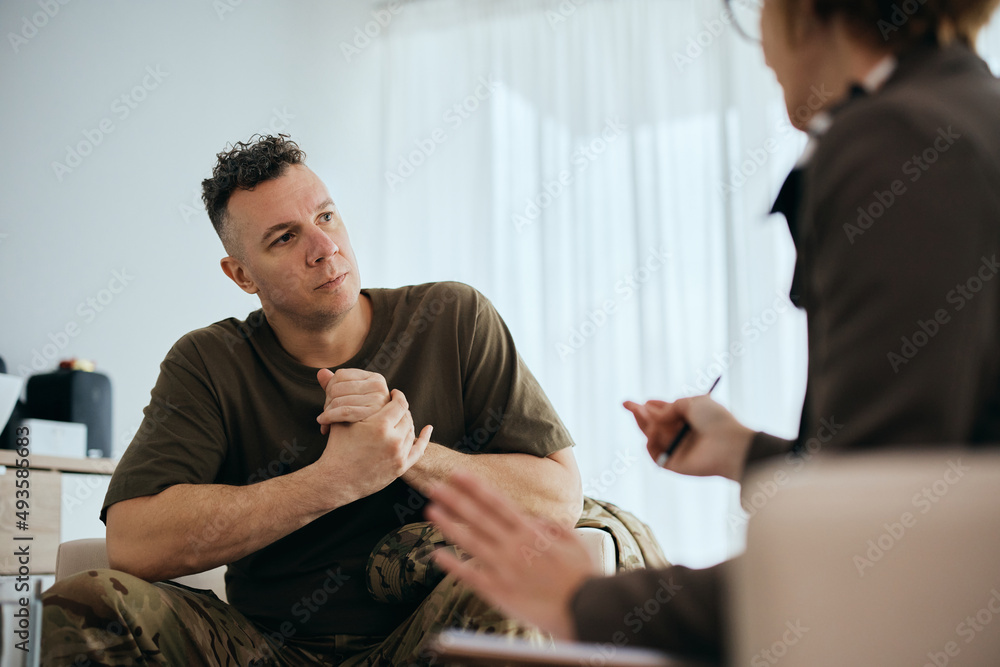 © Drazen - Mid adult veteran talks about his issues with mental health therapist. © Drazen - Mid adult veteran talks about his issues with mental health therapist.