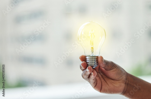 Whats achieved today was once just an idea. Shot of an unrecognisable businesswoman holding a lightbulb.