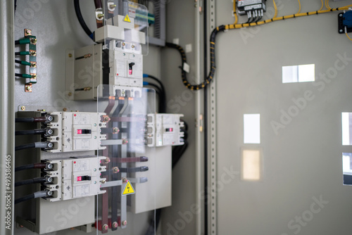 Control panel with circuit breakers, fuses, rails, wiring in the distribution board. Power electric in electrical cabinet control. Electricity and electrical maintenance service. photo