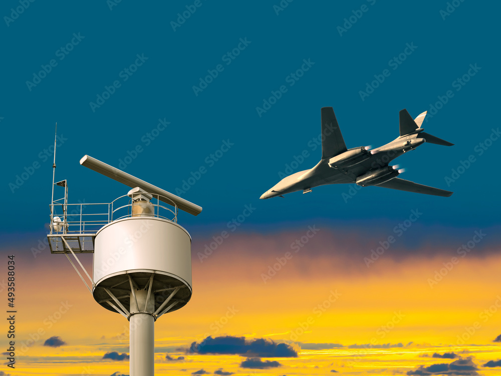 A fighter jet plane flying over a rotating surveillance radar under the Ukraine blue yellow flag colored sky with copy space

