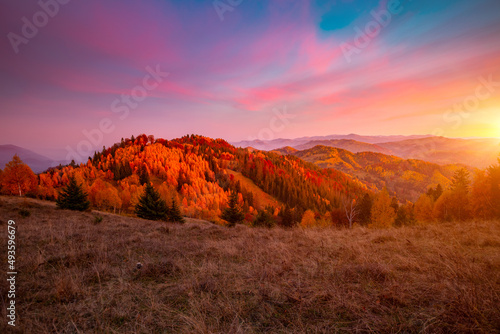 Splendid autumn scene of a rolling hills at sunset. Location Carpathian mountains, Ukraine.