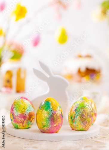Sticker Easter composition with colorful Easter eggs on rabbit dessert plate