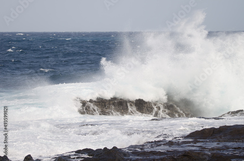 Wave breaking against the shore. El Confital. La Isleta Protected Landscape. Las Palmas de Gran Canaria. Gran Canaria. Canary Islands. Spain.