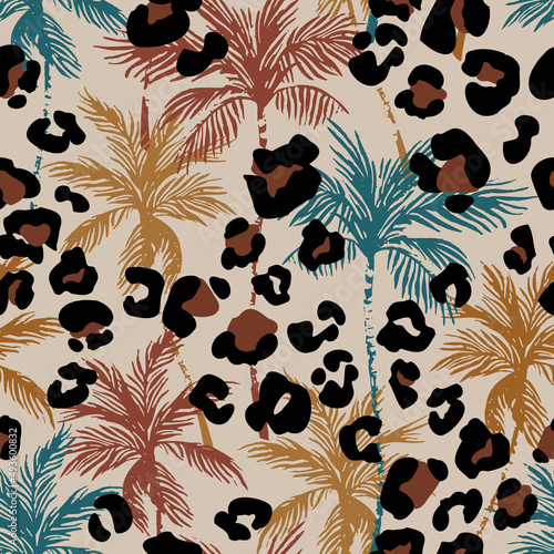 Abstract tropical floral seamless pattern with palm trees silhouette, animal skin print