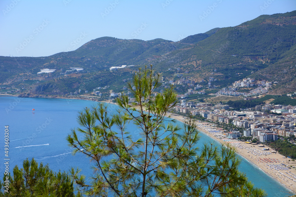 Fototapeta premium cleopatra beach in Alanya with waterfront and mountains on background, view from top