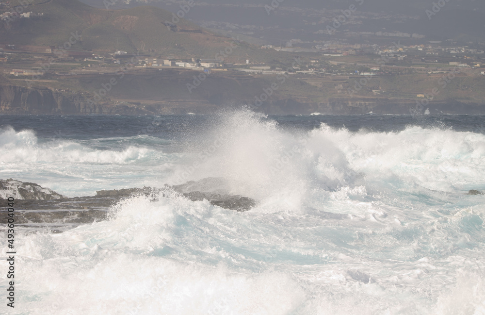 Waves breaking against the shore. El Confital. La Isleta Protected Landscape. Las Palmas de Gran Canaria. Gran Canaria. Canary Islands. Spain. Waves breaking against the shore. El Confital. La Isleta Protected Landscape. Las Palmas de Gran Canaria. Gran Canaria. Canary Islands. Spain.